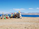 27 Lake Manasarovar Behind Prayer Flags On Ridge Between Lake Manasarovar And Lake Rakshas Tal After driving past the southwestern corner of Lake Manasarovar, we crested a small ridge with prayer flags and a view back to Lake Manasarovar.